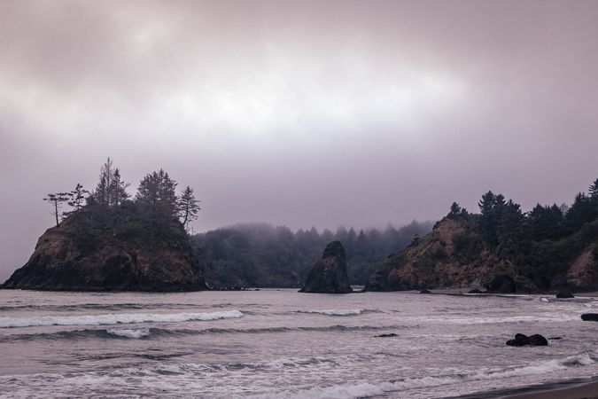 Rocky coast on foggy day