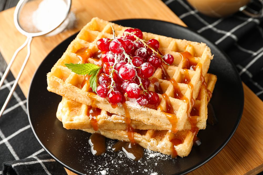 Beautiful composition with sweet waffles, closeup