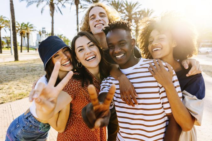 Portrait group of young multicultural trendy friends looking at camera