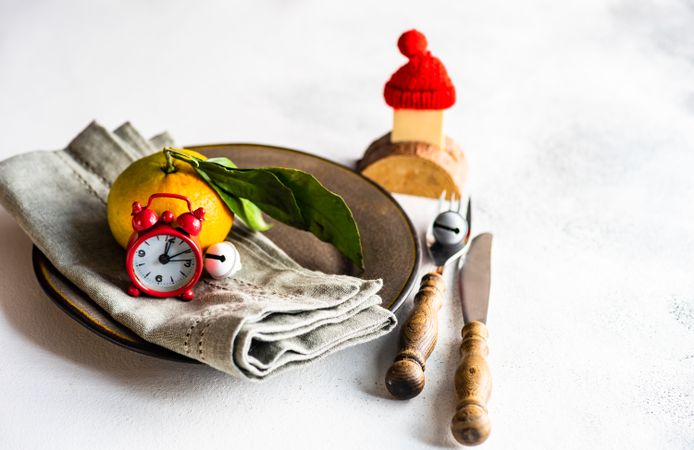 December table setting with tangerine and Santa hat decoration