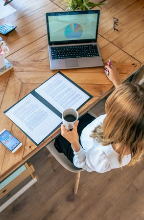 Top view of businesswoman working at the office