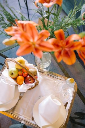 Bouquet and tray on table in hotel room