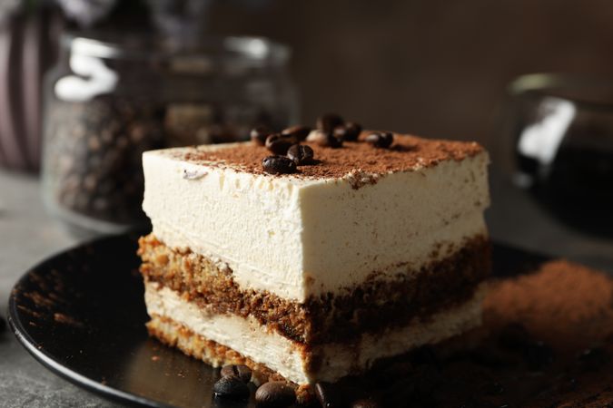 Composition with tasty tiramisu and coffee. Delicious dessert