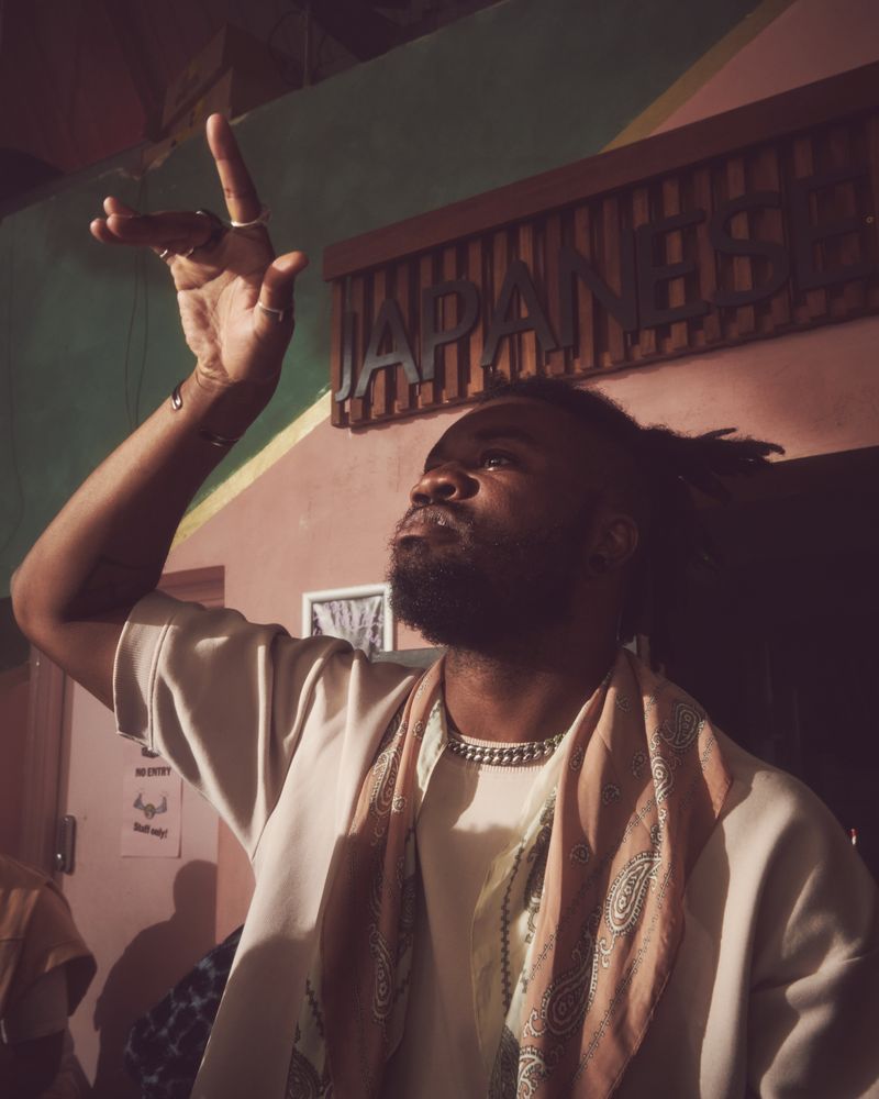 London, England, United Kingdom - Nov 9, 2022: Man with hand up in appreciation of music