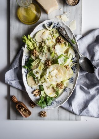 Gourmet salad with fruits, cheese and nuts