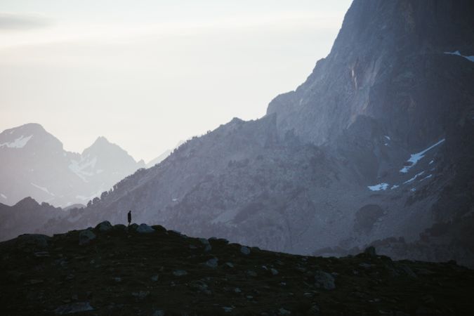 Majestic mountain landscape with human silhouette