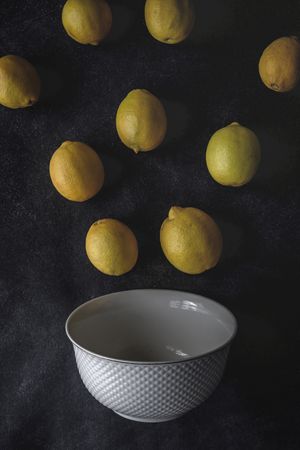 Fresh lemons on dark background.
