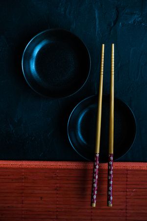 Table setting with chopsticks and two small bowls