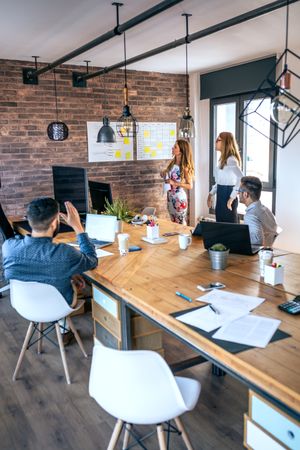 Female manager in a work meeting with her workers