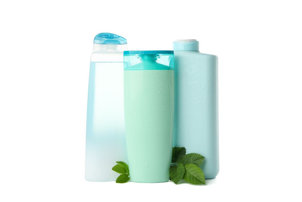 Blank bottles for cosmetics isolated on light background