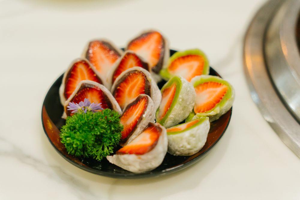 Exquisite Cross-Section of a Japanese Strawberry Daifuku Showing its Mochi, Anko, and Fresh Fruit Layers