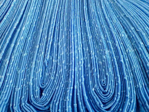 Folded blue curtain fabric