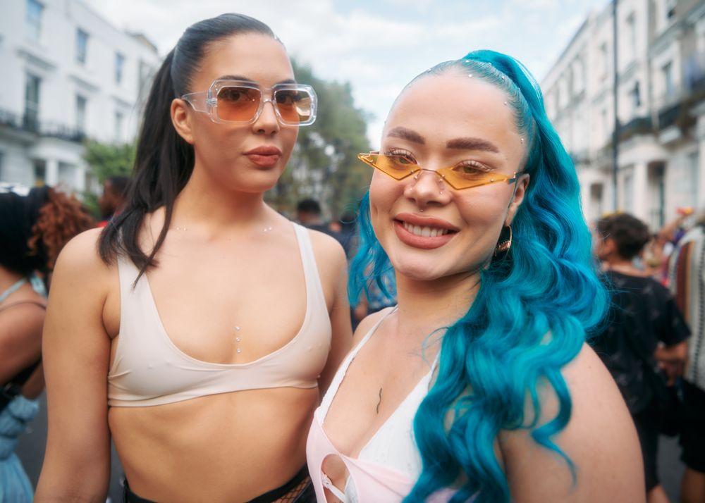 London, England, United Kingdom - August 28, 2022: Two friends with unique sunglasses in London