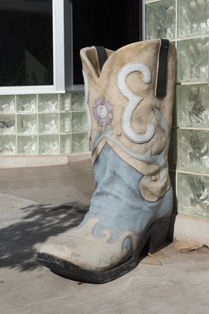 Decorative boot outside the Saddle Club tapas bar and restaurant in Alpine, Texas