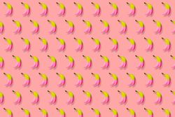 Pink and yellow bananas in rows