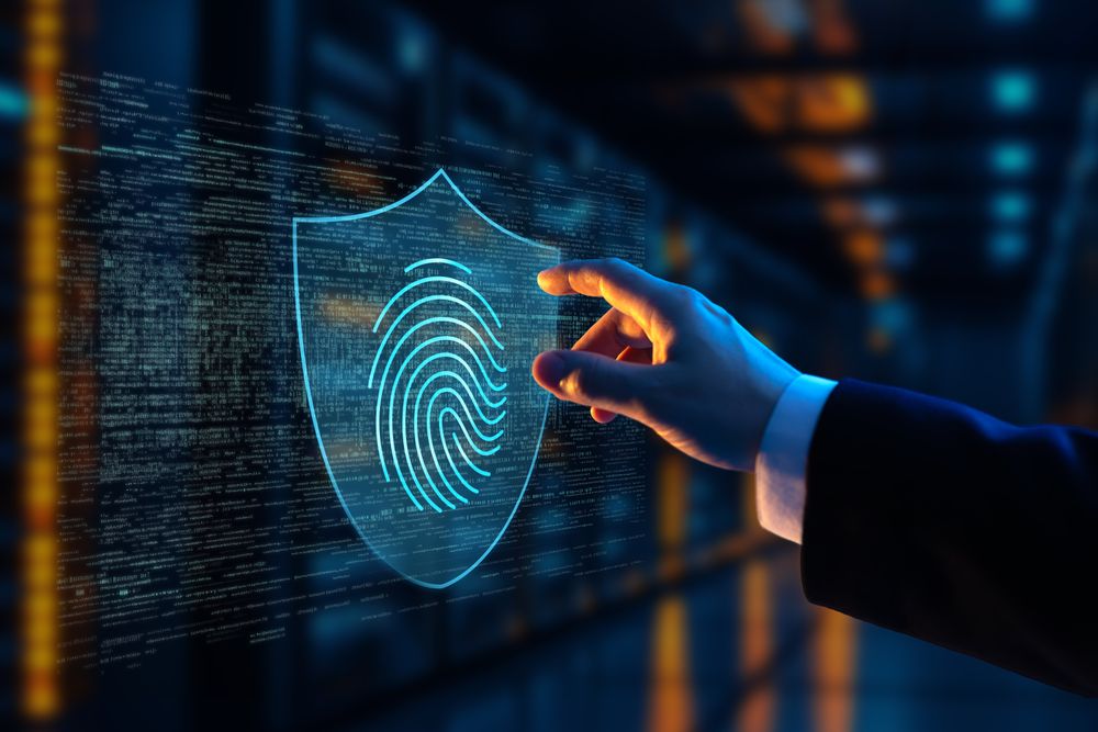 Businessman interacting with holographic fingerprint cybersecurity