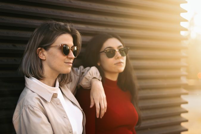 Two women portrait from the side with sunlight