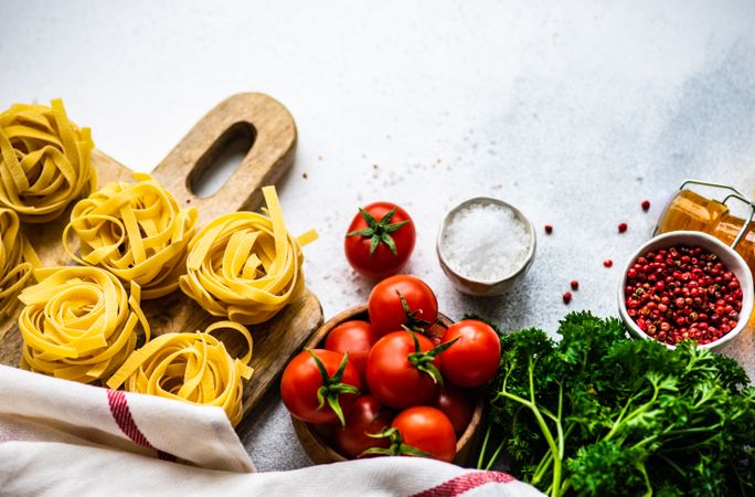 Ingredients for Italian pasta dish on counter with copy space
