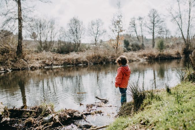 Young girl overlooking a marsh