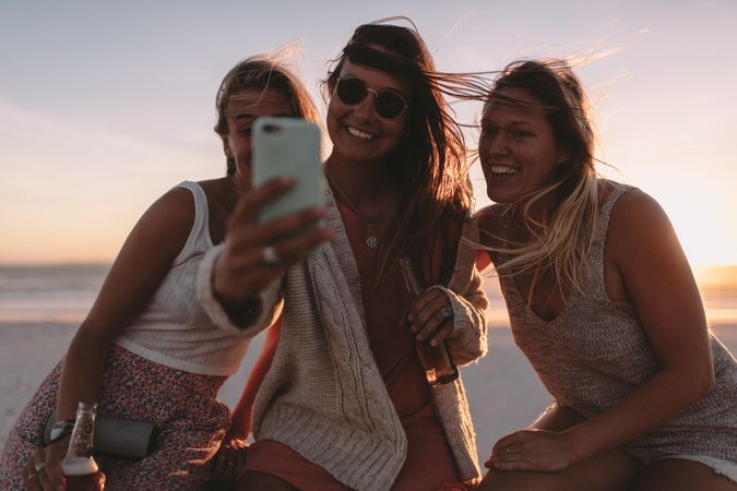 Group of young women taking a selfie outside
