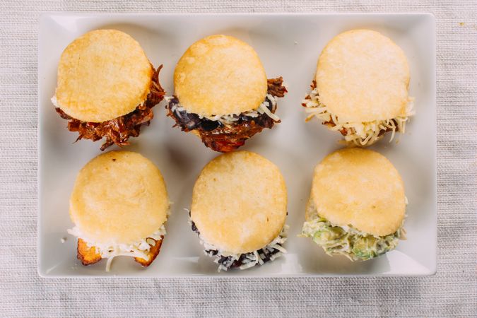 Latin American breakfast, specifically in countries such as Venezuela and Colombia, Arepas with several ingredients to fill like chicken, meat, avocado, cheese
