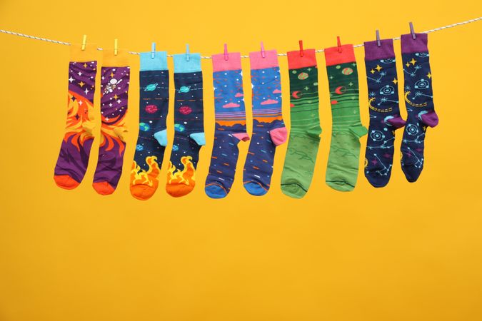 Casual clothes and wearing concept - socks, clothes for foot