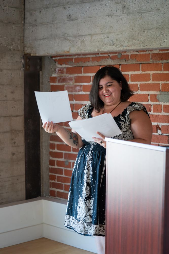 Woman smiling while reviewing her notes