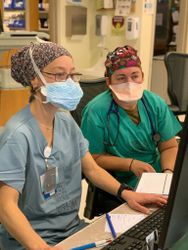 Shiprock, NM - USA, Dec. 19, 2020: Two nurses cross training