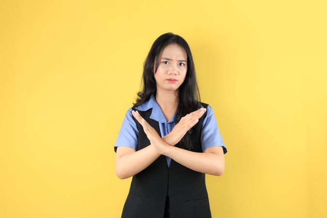 Young Indonesian Woman with Vest Blue Shirt, Making Rejection No Gesture