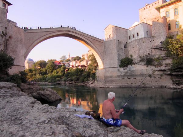 Man fishing near Stari Most bridge in Mostar, Bosnia and Herzegovina