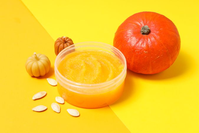 Skin care and face care concept - pumpkin cosmetic