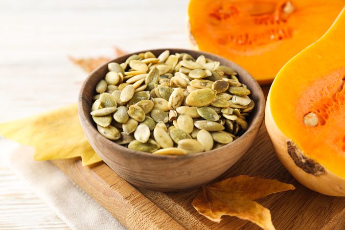 Cooking ingredients for fall season - pumpkin seeds, pumpkin