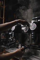 Barista using coffee machine
