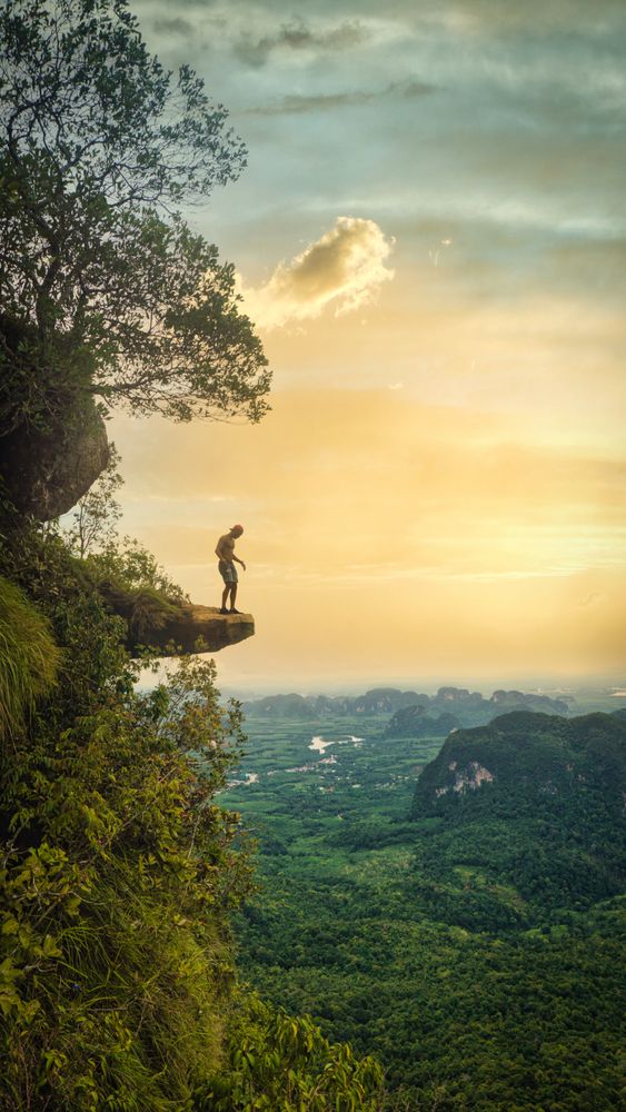Man standing on cliff at Dragon crest mountain crabby