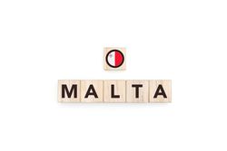 Wooden blocks bearing the name and flag of Malta.
