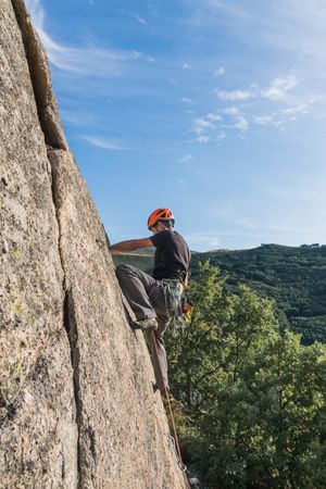 Man climbing a rock