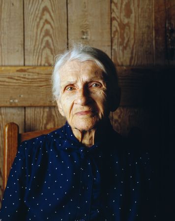 Kate Carter on her 90th birthday poses for Carol M. Highsmith in log cabins, North Carolina