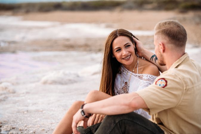 adorable couple on an amazing beach with pink water