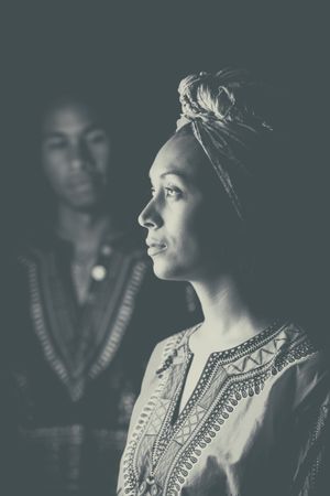 Black man looking at thoughtful woman