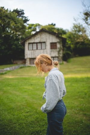 Content female walking on grass in countryside