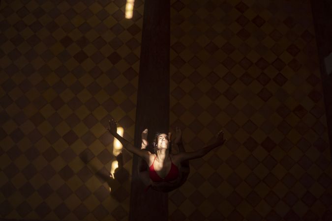 Woman dancing in dark church