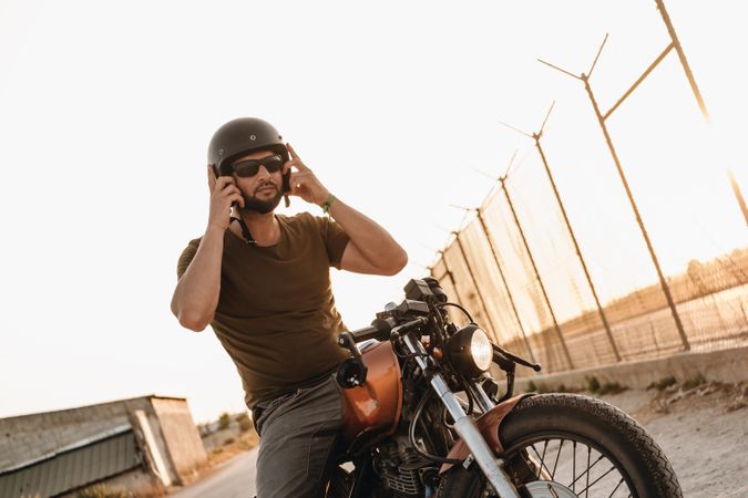 Strong man driving motorcycle