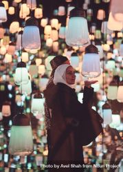 Tokyo, Japan - November 19th, 2019: Woman wearing a hijab interacting with art installation 0v3dG5