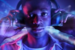 Black man in headphones listening to music