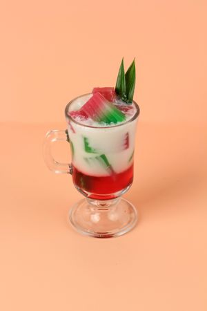 Refreshing summer drink with red syrup and jelly