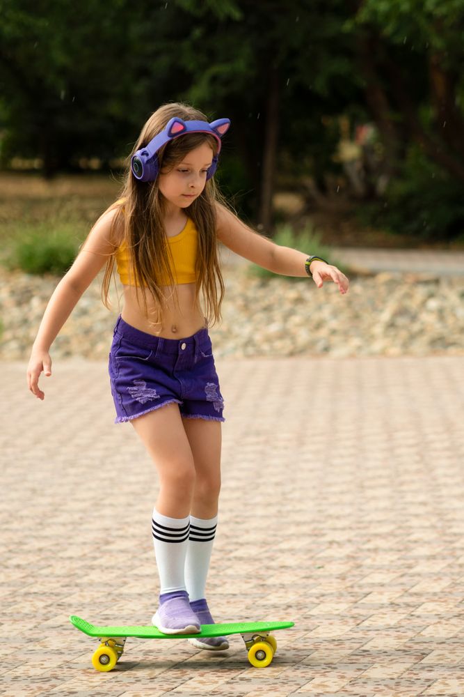 Fashionable Female Child with Skateboard