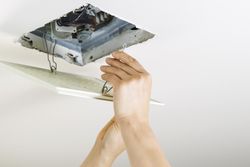 Installing bathroom fan vent cover after cleaning