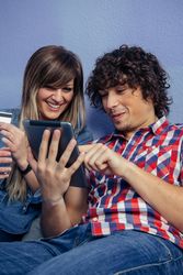 Couple making online purchase with tablet