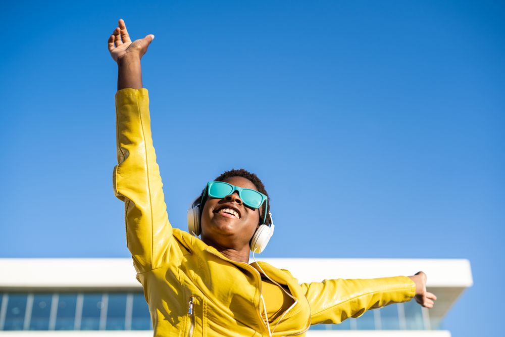 Joyful female smiling and jumping