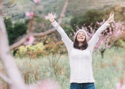 Happy woman in spring countryside